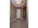 Inviting home entryway featuring decorative floor tiles, modern lighting, and a sleek front door at 10349 Bressana Dr, Las Vegas, NV 89135