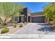 Contemporary home featuring a paved driveway and well-maintained landscaping at 10349 Bressana Dr, Las Vegas, NV 89135