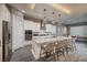 Bright kitchen features a large island, stainless steel appliances, and stylish pendant lighting at 10349 Bressana Dr, Las Vegas, NV 89135