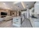 Well-lit kitchen featuring a center island with seating, stainless steel appliances, and modern finishes at 10349 Bressana Dr, Las Vegas, NV 89135