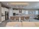 Stylish kitchen with a granite island and modern appliances, open to the living area at 10349 Bressana Dr, Las Vegas, NV 89135