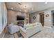 Spacious living room showcasing a modern design, stylish furnishings, and tile flooring at 10349 Bressana Dr, Las Vegas, NV 89135