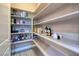 Organized pantry with ample shelving for storage, offering a convenient kitchen solution at 10349 Bressana Dr, Las Vegas, NV 89135