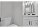 Clean bathroom with a toilet, vanity, framed mirror and a shower-tub combo at 10373 Midnight Iris St, Las Vegas, NV 89183