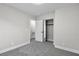 Neutral bedroom with closet and entryway features gray carpet and white trim at 10373 Midnight Iris St, Las Vegas, NV 89183