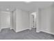 A bedroom with an archway to another room and carpet at 10373 Midnight Iris St, Las Vegas, NV 89183