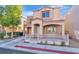 Charming two-story home with front yard, wrought iron gate and an attached garage at 10373 Midnight Iris St, Las Vegas, NV 89183
