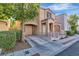 Charming two-story home with front yard, wrought iron gate and an attached garage at 10373 Midnight Iris St, Las Vegas, NV 89183