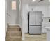 Bright kitchen featuring stainless steel appliances, including a large refrigerator at 10373 Midnight Iris St, Las Vegas, NV 89183
