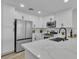 Modern kitchen features updated appliances, ample counter space and bright, white cabinets at 10373 Midnight Iris St, Las Vegas, NV 89183