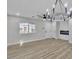 Bright living room features modern lighting and wood-look flooring at 10373 Midnight Iris St, Las Vegas, NV 89183