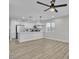 Open concept living area showcases modern lighting, bar seating and updated kitchen at 10373 Midnight Iris St, Las Vegas, NV 89183