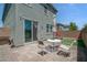 Cozy backyard patio with lush artificial turf, ideal for relaxation and outdoor dining at 10630 Adobe Ranch St, Las Vegas, NV 89141
