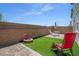 Landscaped backyard, combining patio area and turf, ideal for outdoor activities at 10630 Adobe Ranch St, Las Vegas, NV 89141