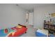 bedroom with a playful car themed bedding set, a small table, and carpeted flooring at 10630 Adobe Ranch St, Las Vegas, NV 89141