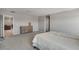 Cozy bedroom with carpet, natural light, and neutral walls, plus a dresser and a door leading to other rooms at 10630 Adobe Ranch St, Las Vegas, NV 89141