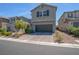 Charming two-story home with a two-car garage and well-maintained landscaping at 10630 Adobe Ranch St, Las Vegas, NV 89141
