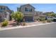 Two-story home with landscaped front yard and attached two-car garage at 10630 Adobe Ranch St, Las Vegas, NV 89141