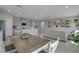 Sun-filled open-concept living area shows the dining area, kitchen, and comfortable living space at 10630 Adobe Ranch St, Las Vegas, NV 89141