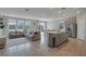 Open-concept living area filled with natural light, seamlessly connecting the kitchen, dining, and living spaces at 10630 Adobe Ranch St, Las Vegas, NV 89141