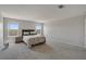 Comfortable main bedroom features ample space, cozy furnishings, and natural light from the two large windows at 10630 Adobe Ranch St, Las Vegas, NV 89141