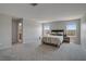 Large main bedroom boasts lots of space, lots of light, and an ensuite bathroom for convenience at 10630 Adobe Ranch St, Las Vegas, NV 89141