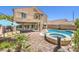 Backyard features a pool, hot tub, patio, outdoor seating area and mature foliage at 11219 Playa Bonita Ave, Las Vegas, NV 89138