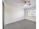 Cozy bedroom with neutral carpet, white walls, and a bright window with blinds at 11219 Playa Bonita Ave, Las Vegas, NV 89138