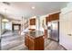 Updated kitchen with granite countertops, stainless steel appliances, and central island at 11219 Playa Bonita Ave, Las Vegas, NV 89138