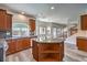 Updated kitchen with granite countertops, stainless steel appliances, and central island at 11219 Playa Bonita Ave, Las Vegas, NV 89138