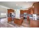 Updated kitchen with granite countertops, stainless steel appliances, and wood cabinets at 11219 Playa Bonita Ave, Las Vegas, NV 89138