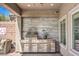 Covered patio area featuring a stainless steel outdoor kitchen at 11219 Playa Bonita Ave, Las Vegas, NV 89138