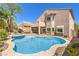 Backyard features a pool, jacuzzi, patio, outdoor kitchen and covered patio area at 11219 Playa Bonita Ave, Las Vegas, NV 89138