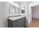 Updated bathroom with gray vanity, granite counters, and a framed mirror at 1440 Vegas Valley Dr # 13, Las Vegas, NV 89169