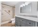 Updated bathroom features a modern vanity with granite top and a tiled shower with grab bar at 1440 Vegas Valley Dr # 13, Las Vegas, NV 89169