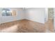 Open bedroom with wood-look flooring and an adjacent bathroom space at 1440 Vegas Valley Dr # 13, Las Vegas, NV 89169