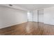 Spacious bedroom with wood-look floors and large sliding closet doors for ample storage at 1440 Vegas Valley Dr # 13, Las Vegas, NV 89169