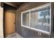 Exterior door and window of condo with a view of a palm tree reflecting, offering privacy and a tropical vibe at 1440 Vegas Valley Dr # 13, Las Vegas, NV 89169