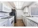 Modern kitchen features stainless steel appliances, quartz countertops, and hardwood style flooring at 1440 Vegas Valley Dr # 13, Las Vegas, NV 89169