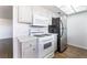 Kitchen with stainless steel appliances, white cabinetry, and hardwood floors at 1440 Vegas Valley Dr # 13, Las Vegas, NV 89169