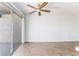 Living room featuring hardwood floors, neutral walls, and sliding glass doors to a private patio at 1440 Vegas Valley Dr # 13, Las Vegas, NV 89169