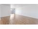 Bright and airy living room with wood flooring and a sliding glass door leading to a balcony at 1440 Vegas Valley Dr # 13, Las Vegas, NV 89169