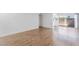 Bright living room with wood-style floors and balcony access; a perfect space to enjoy relaxation and natural light at 1440 Vegas Valley Dr # 13, Las Vegas, NV 89169