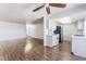 Spacious living room featuring hardwood floors, neutral walls, and open layout to the kitchen at 1440 Vegas Valley Dr # 13, Las Vegas, NV 89169