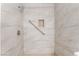 Tiled shower with a grab bar and built-in niche for a safe and stylish bathing experience at 1440 Vegas Valley Dr # 13, Las Vegas, NV 89169