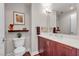 Elegant bathroom featuring a wood vanity with quartz countertop and modern fixtures at 150 Las Vegas Blvd # 1906, Las Vegas, NV 89101