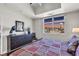 Comfortable bedroom with hardwood floors, a dresser, and a window view of the city skyline at 150 Las Vegas Blvd # 1906, Las Vegas, NV 89101