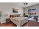 Comfortable bedroom showcases hardwood floors, ceiling fan, and a scenic city view from the window at 150 Las Vegas Blvd # 1906, Las Vegas, NV 89101