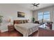 Cozy bedroom with hardwood floors, a ceiling fan, and a captivating city view through the window at 150 Las Vegas Blvd # 1906, Las Vegas, NV 89101