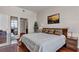 Inviting bedroom with hardwood floors, comfortable bedding, and view into the ensuite bathroom at 150 Las Vegas Blvd # 1906, Las Vegas, NV 89101